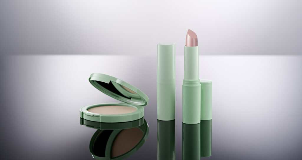 Grüne Monomaterial-Puderdose und Lippenstift